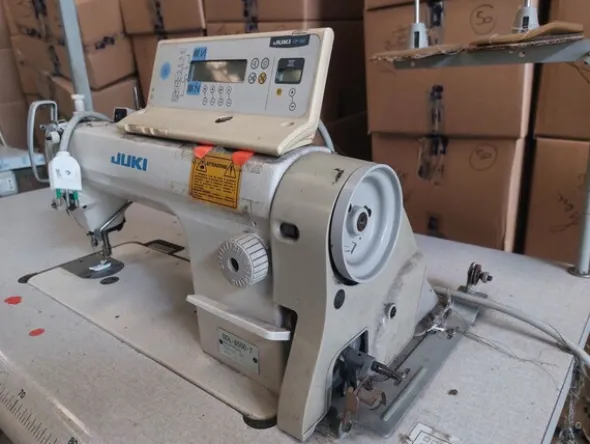 1#8180 Rimanenze di magazzino abbigliamento e macchine per confezionamento